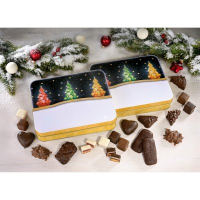 Preview of logo printing options on gingerbread tin, surrounded by confectionery and decorations