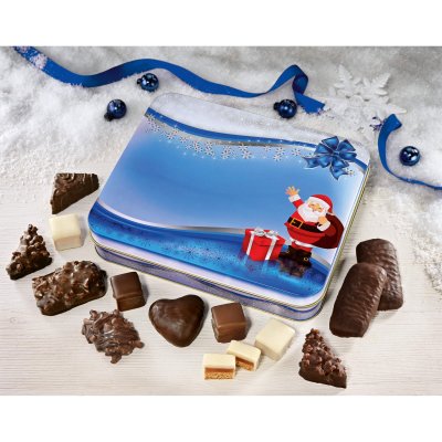 Lebkuchen Präsentdose in zeitlosem Weihnachts-Design umgeben von Lebkuchen und -konfekt