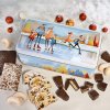 Open “Winter Dream” gingerbread chest with Nuremberg Lebkuchen, gingerbread confectionery, Christstollen, and Christmas cookies 