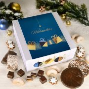 Geschenkbox geöffnet mit Lebkuchendose, Plätzchen und verschiedenem Weihnachtsgebäck Geschenkbox geöffnet mit Lebkuchendose, Plätzchen und verschiedenem Weihnachtsgebäck